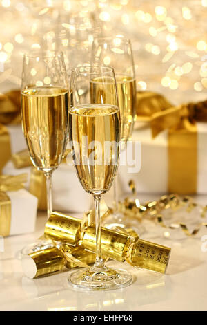Glass of champagne against sparkle background Stock Photo