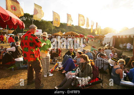 Festival goers hanging out at Bestival on the Isle of Wight. Stock Photo