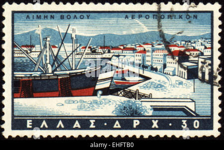GREECE - CIRCA 1960s: A stamp printed in Greece shows Volos harbor Stock Photo