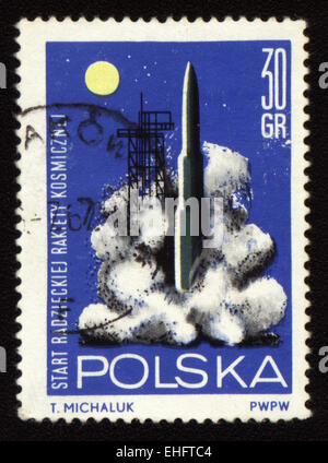 Postage stamp printed in Poland shows rocket start Stock Photo