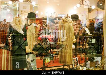 Fur coats for sale in shop windows in Plovdiv Bulgaria. Stock Photo