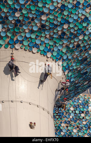 Workers hanging on ropes at the sphere of a Kuwait Tower Stock Photo