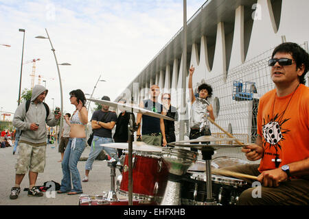 Cool guy playing techno beats on his drum kit outside Sonar by Night Barcelona. Stock Photo