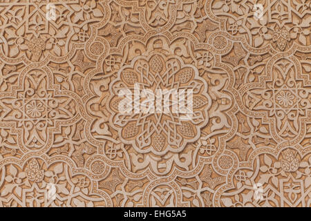 Wall detail of Alhambra UNESCO site in Granada - South of Spain. 600 years old arabic characters. Stock Photo