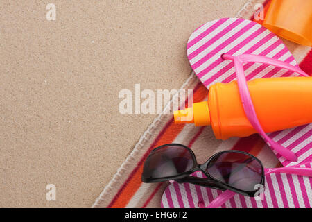 Accessories for the beach lying on the sand, with place for your text Stock Photo