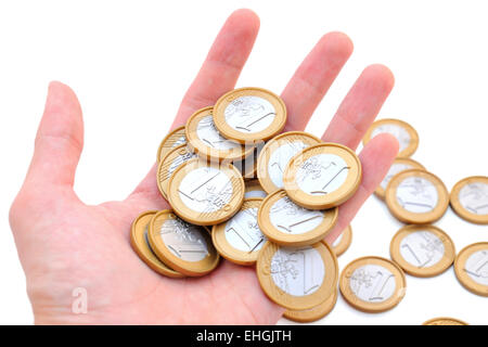 Human hand holding Euro coins, isolated on white background. Stock Photo