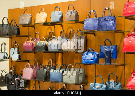 Store suitcases and bags, glass shelves with goods Stock Photo