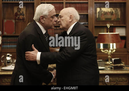 Athens, Greece. 13th Mar, 2015. Outgoing Greek President Karolos Papoulias (R) hugs the newly elected President Prokopis Pavlopoulos during a handover ceremony at the Presidential Palace in Athens, Greece, on March 13, 2015. The new president of the Hellenic Republic, Prokopis Pavlopoulos, was sworn in on Friday. © Yannis Kolesidis/Pool/Xinhua/Alamy Live News Stock Photo