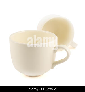 Two ceramic cream colored cups composition Stock Photo