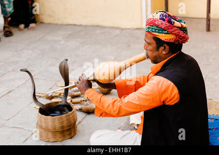 Snake charmer outside the Jaipur City Palace and Museum. Stock Photo