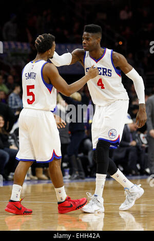 March 13, 2015: Philadelphia 76ers center Nerlens Noel (4) celebrates with guard Ish Smith (5) during the NBA game between the Sacramento Kings and the Philadelphia 76ers at the Wells Fargo Center in Philadelphia, Pennsylvania. The Philadelphia 76ers won 114-107. Stock Photo