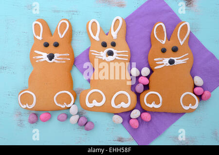 Easter bunny gingerbread cookies on blue distressed wood table. Stock Photo