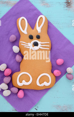 Easter bunny gingerbread cookies on blue distressed wood table. Stock Photo