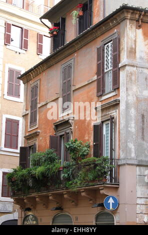 Balcony with plants in a old building Stock Photo