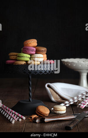 Delicious macaroons on cake stand Stock Photo