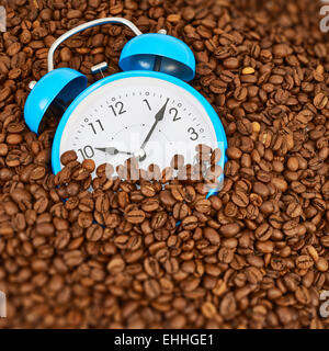 Alarm clock on coffee beans Stock Photo