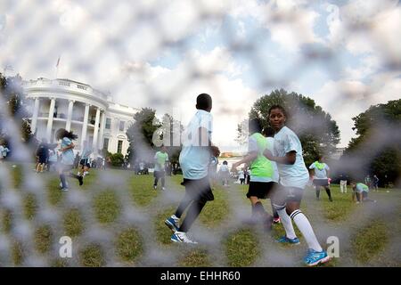 Students from DC Scores participate in a soccer clinic on the South Lawn of the White House following President Barack Obama's event with Sporting Kansas City honoring the team and their victory in the 2013 MLS Cup Championship October 1, 2014 in Washington, DC. Stock Photo