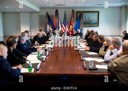 US President Barack Obama meets with senior military leadership at the Pentagon October 8, 2014 in Arlington, Virginia. Seated next to the President are Defense Secretary Chuck Hagel and Joint Chiefs Chairman Gen. Martin Dempsey, Chairman. Stock Photo