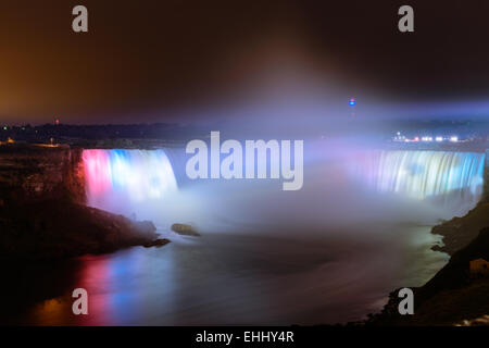 Niagara Falls illuminated colored lights at night Stock Photo