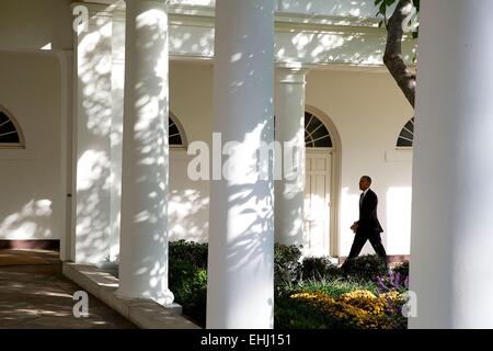 US President Barack Obama walks on the Colonnade of the White House October 29, 2014 in Washington, DC. Stock Photo