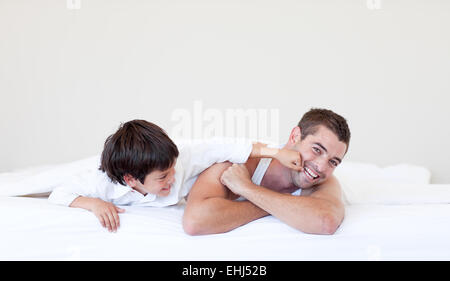 Laughing father and son having fun Stock Photo