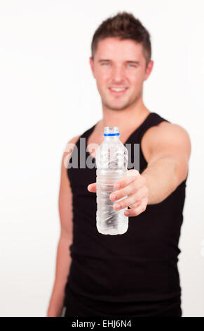 Happy Sportsman holding water bottle Stock Photo