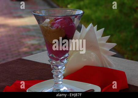 on the table is an ice cream in a crystal glass Stock Photo