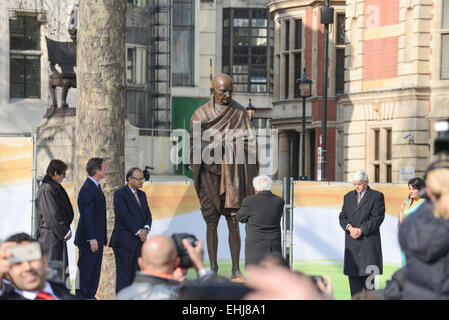 Parliament Square, London, UK. 14th March 2015. Gopalkrishna Gandhi grandson of Gandhi stands in front of the new statue. Bronze statue of Mahatma Gandhi by British sculptor Philip Jackson, is unveiled in Parliament Square. Credit:  Matthew Chattle/Alamy Live News Stock Photo