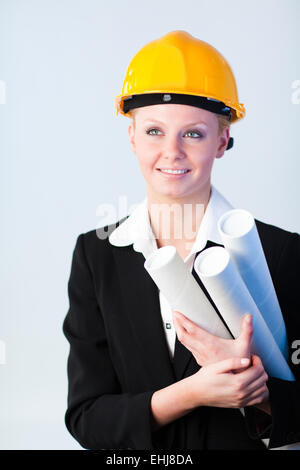 female constrcution worker with blueprints Stock Photo