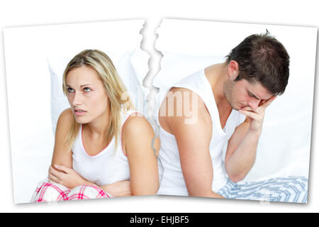 Angry couple sitting against each other Stock Photo