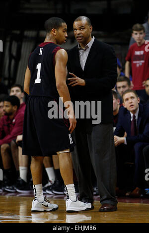 Philadelphia, Pennsylvania, USA. 14th Mar, 2015. Harvard Crimson head coach Tommy Amaker talks with guard Siyani Chambers (1) during the NCAA basketball game between the Yale Bulldogs and the Harvard Crimson at the Palestra in Philadelphia, Pennsylvania. Credit:  csm/Alamy Live News Stock Photo