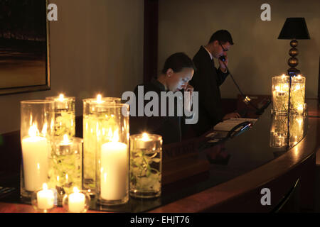 Earth Day energy saving night in the lobby reception of the Four Seasons Hotel Sydney, Sydney Australia Stock Photo