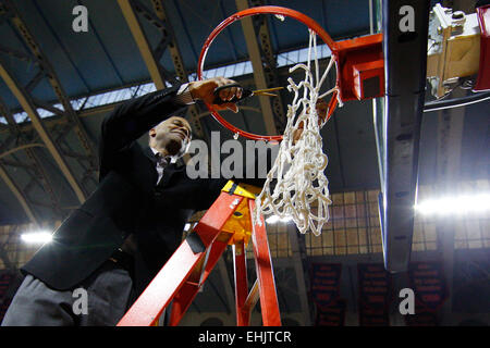 March 14, 2015: Harvard Crimson head coach Tommy Amaker cuts down the net following the NCAA basketball game between the Yale Bulldogs and the Harvard Crimson at the Palestra in Philadelphia, Pennsylvania. The Harvard Crimson won 53-51 to win the Ivy League Playoff game. Stock Photo