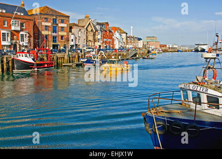 Weymouth Dorset and fishing boats moored to the quayside in the harbour. Stock Photo