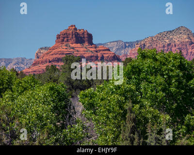 Sweeping view of red rock buttes and trees with focus on Bell Rock, Sedona, Arizona, USA, May 2014. Stock Photo