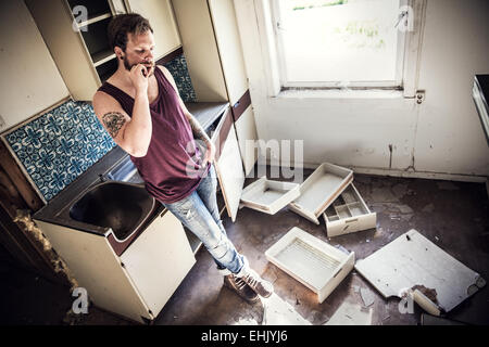 A young and exhausted redneck / rocker with hangover. Stock Photo