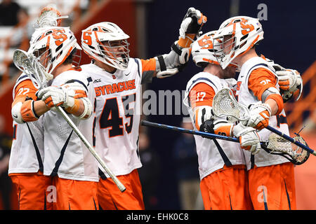 Syracuse, New York, USA. 14th Mar, 2015. Syracuse Orange players celebrate a goal during a NCAA men's lacrosse game between the Johns Hopkins Blue Jays and the Syracuse Orange at the Carrier Dome in Syracuse, New York. Syracuse defeated Johns Hopkins 13-10. Rich Barnes/CSM/Alamy Live News Stock Photo