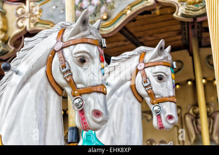 closeup of two horses in a nostalgic carousel Stock Photo
