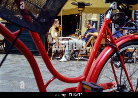 Adult couple sitting outside a bar in Copenhagen. Denmark Stock Photo