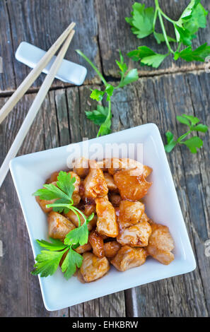 fried meat in bowl and on a table Stock Photo