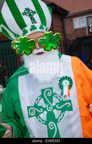 Manchester, UK 15th March, 2015.  The St Patrick's weekend Irish Festival.  Thousands of people lined the streets to watch as the St Patrick’s Day parade made its way through Manchester.  The colourful procession set off from the Irish World Heritage Centre in Cheetham Hill before making its way to Albert Square.  Flag bearers representing the 32 counties in the Emerald Isle led the parade into the city centre, followed by floats from the city’s Irish associations. Stock Photo