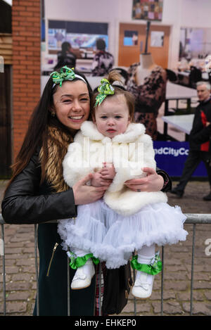 Daughter Freya Walker, 2 and mother Molly Mooney, 22 enjoy a joint Mothers Day and St. Patricks Day in Birmingham. Stock Photo