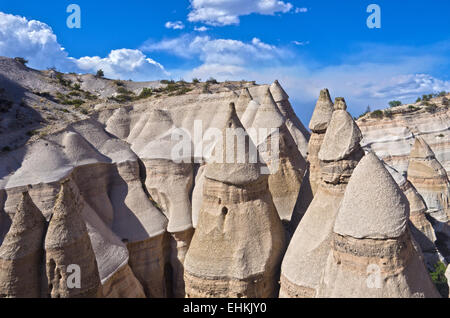 Kasha-Katuwe Tent Rocks National Monument, New Mexico. Tan colored hoodoos with hat shaped cap rocks rise into the sky. Stock Photo