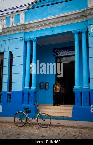 Bicycle and colourful post office in Trinidad, Cuba Stock Photo