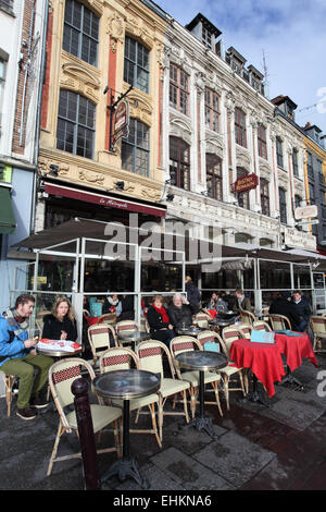 People having a drink on the terrace of the Metropole Cafe, Place Rihour, Lille, Nord, France Stock Photo