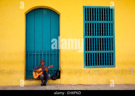 A man plays guitar in Trinidad, Cuba Stock Photo