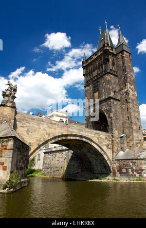 PRAGUE, CZECH REPUBLIC - JUNE 15, 2012: Arch of the Charles Bridge in Prague, Czech Republic on June 15, 2012. Stock Photo