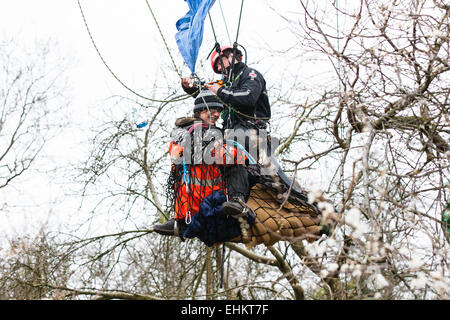 Bristol, UK. 15th Mar, 2015. A specialist eviction climber lowers a protester to the ground ready to be evicted.  A fourth day of evictions from a protest site, occupied to prevent work starting on a Metrobus project, saw the tree-top camps cleared and protesters evicted. Bristol, UK. 15th March 2015. Credit:  Redorbital Photography/Alamy Live News Stock Photo