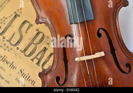 German ancient violin and notes. Old violin, copy of Majini made Saxony, in the 19th century. Stock Photo