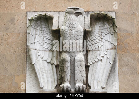 Reichsadler. Nazi eagle from the 1930s on the main building of the Tempelhof Airport in Berlin, Germany. Stock Photo